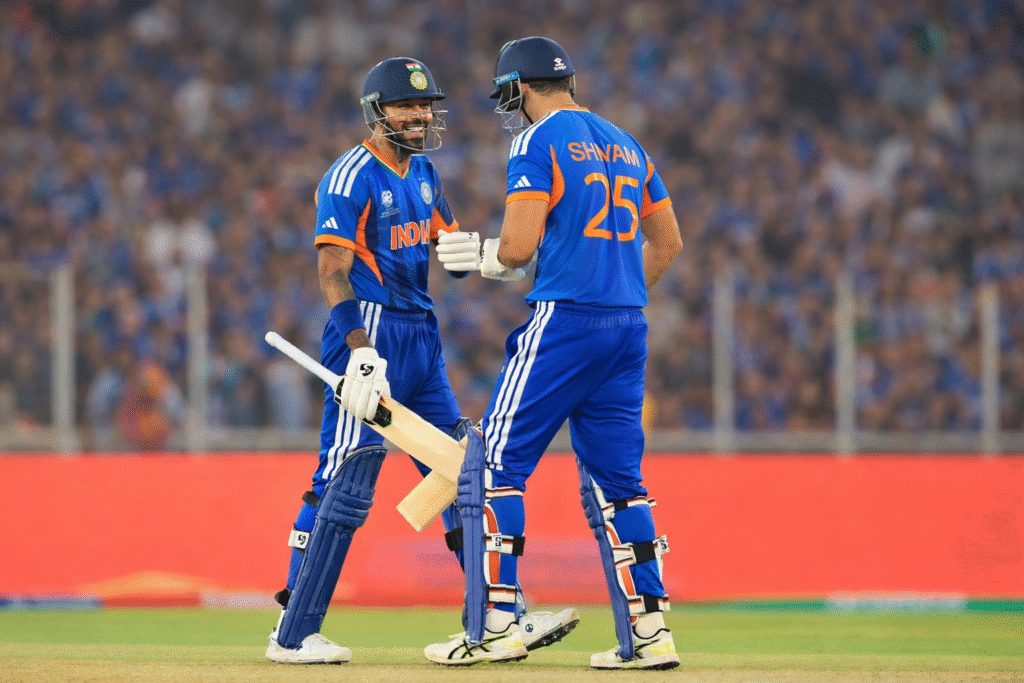 India vs Netherlands cricket match 2026 where Indian batsmen celebrate a successful partnership during the game in blue team jerseys