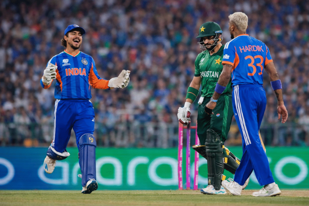 India vs Pakistan T20 World Cup match moment showing Indian players celebrating while Pakistani batsman walks back near the stumps in a packed stadium.